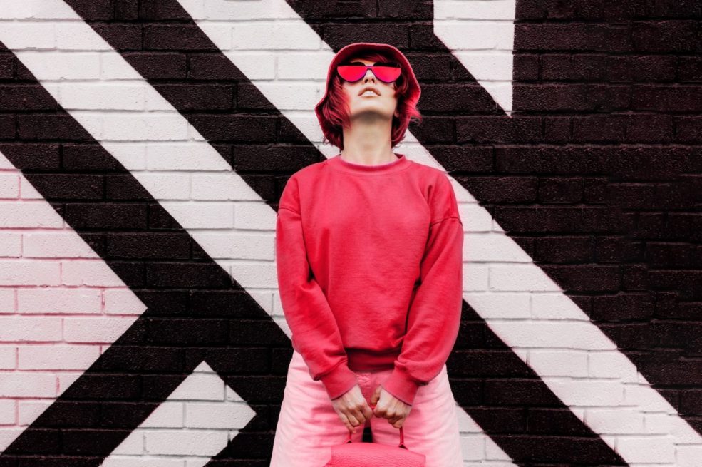 hipster-fashio-woman-in-trendy-viva-magenta-color-sweatshirt-and-sunglasses-color-of-2023-year--e1680748926892